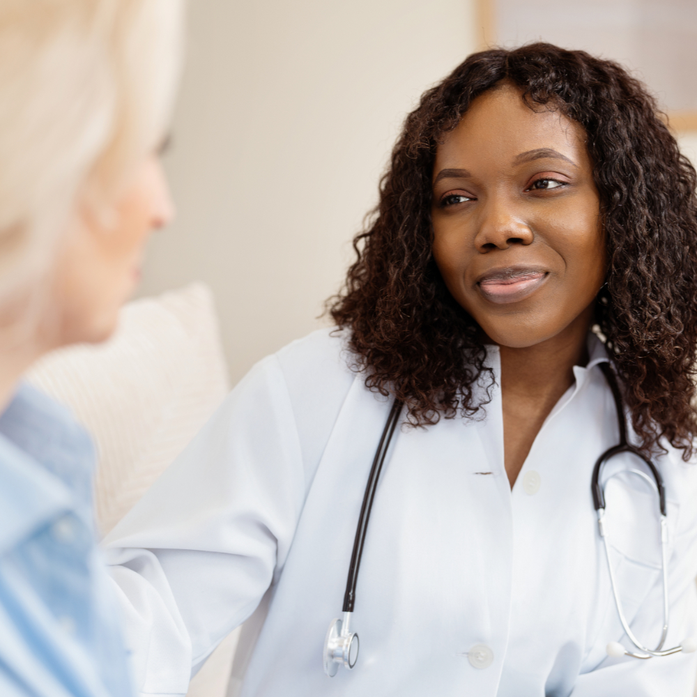 Female physician listening to a patient during a medical consultation
