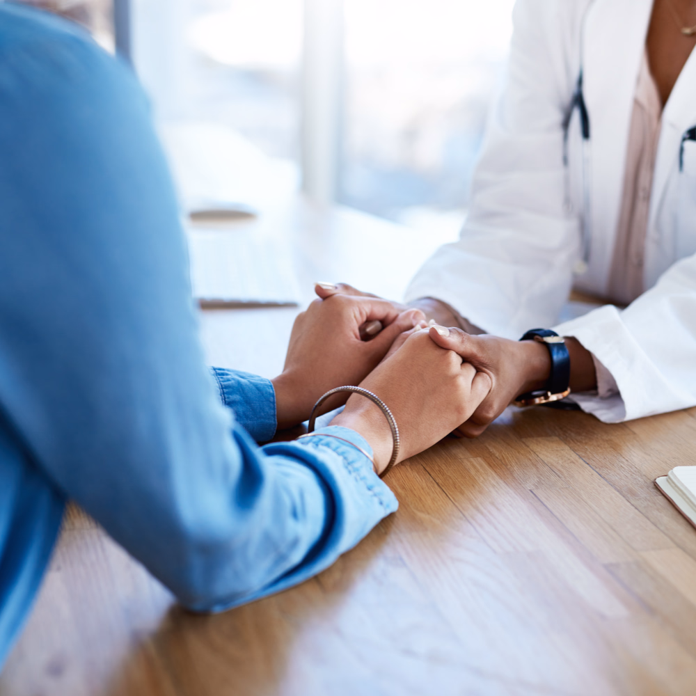Healthcare Professional Holds Patient's Hands With Compassion
