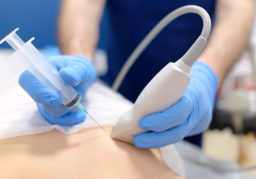 Healthcare professional using an ultrasound probe during a medical examination