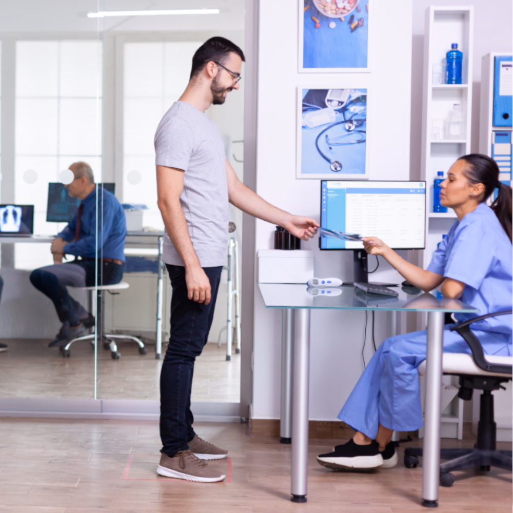 Patients And Staff In Hospital Waiting Area