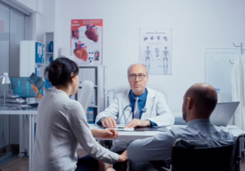 Doctor discussing medical concerns with a patient during an office consultation
