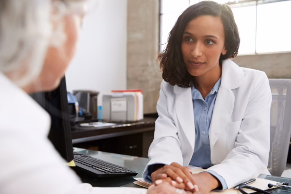 Doctor Consults Elderly Patient